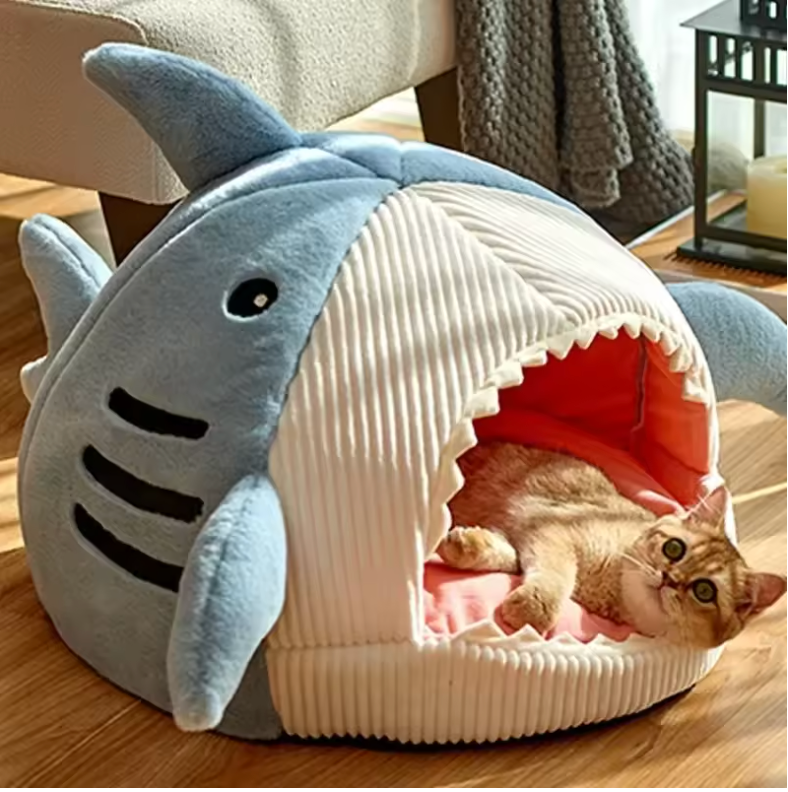 Enclosed Warm Cat Bed featuring a cozy cave design with a shark shape, perfect for indoor naps and warmth.